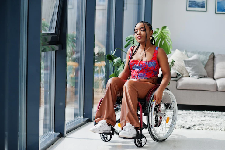young-disabled-african-american-woman-wheelchair-home_627829-12443